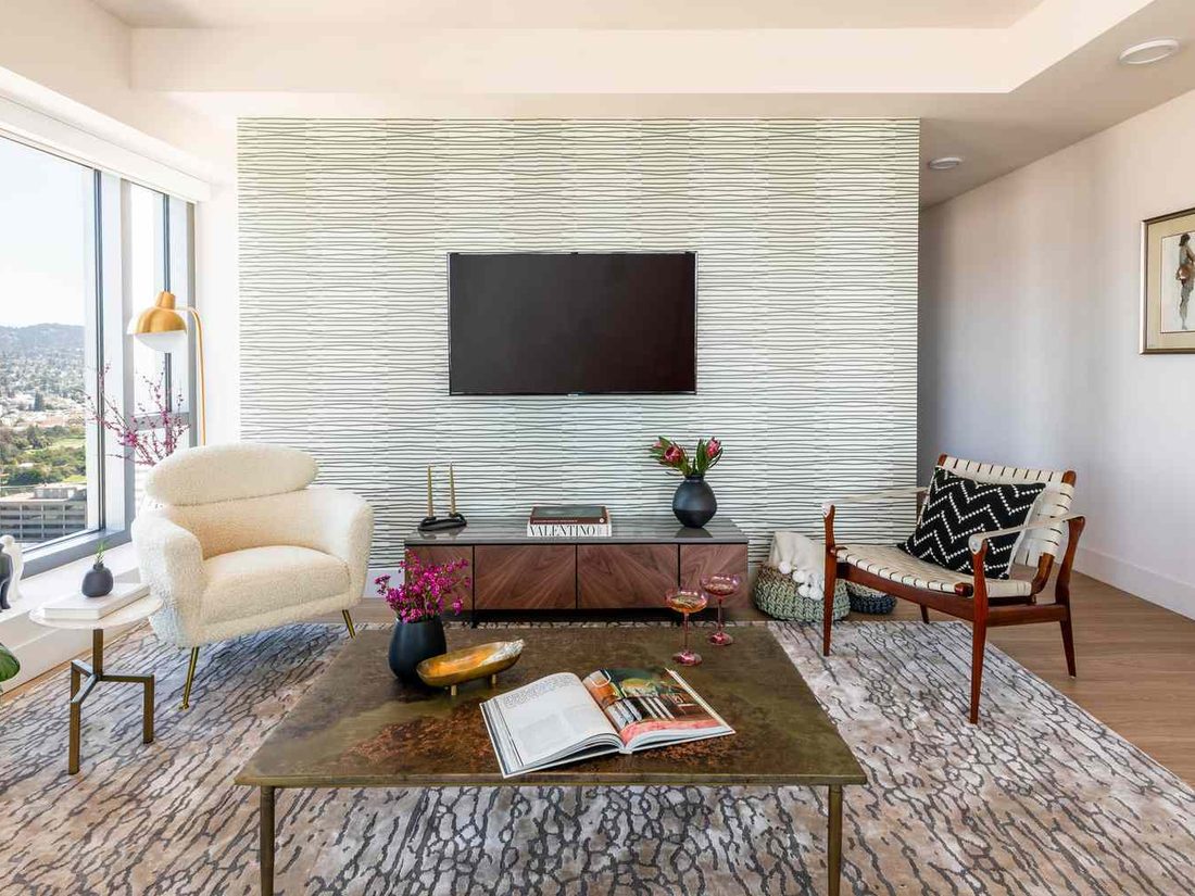 Elegant living room with a textured statement wallpaper accent wall
